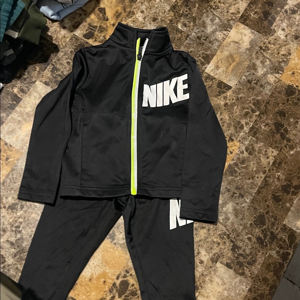 Nike Black Jacket with White Logo and Yellow Zipper